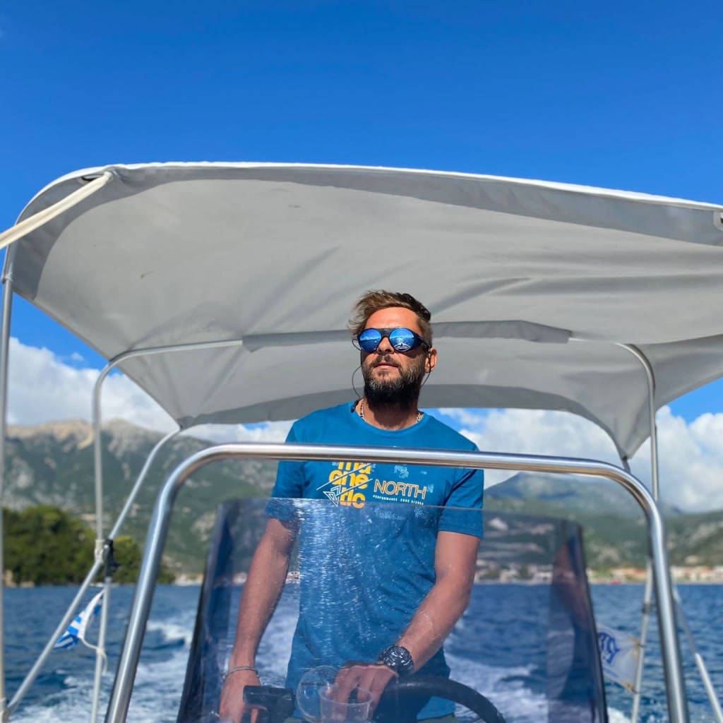 Cristian Soare CEO of Riding.ro being the skipper of a private motorboat cruise around Lefkada island on the Ionian sea